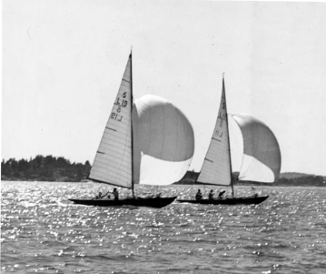 Two classic 8mR yachts racing downwind with spinnakers in the Finnish archipelago